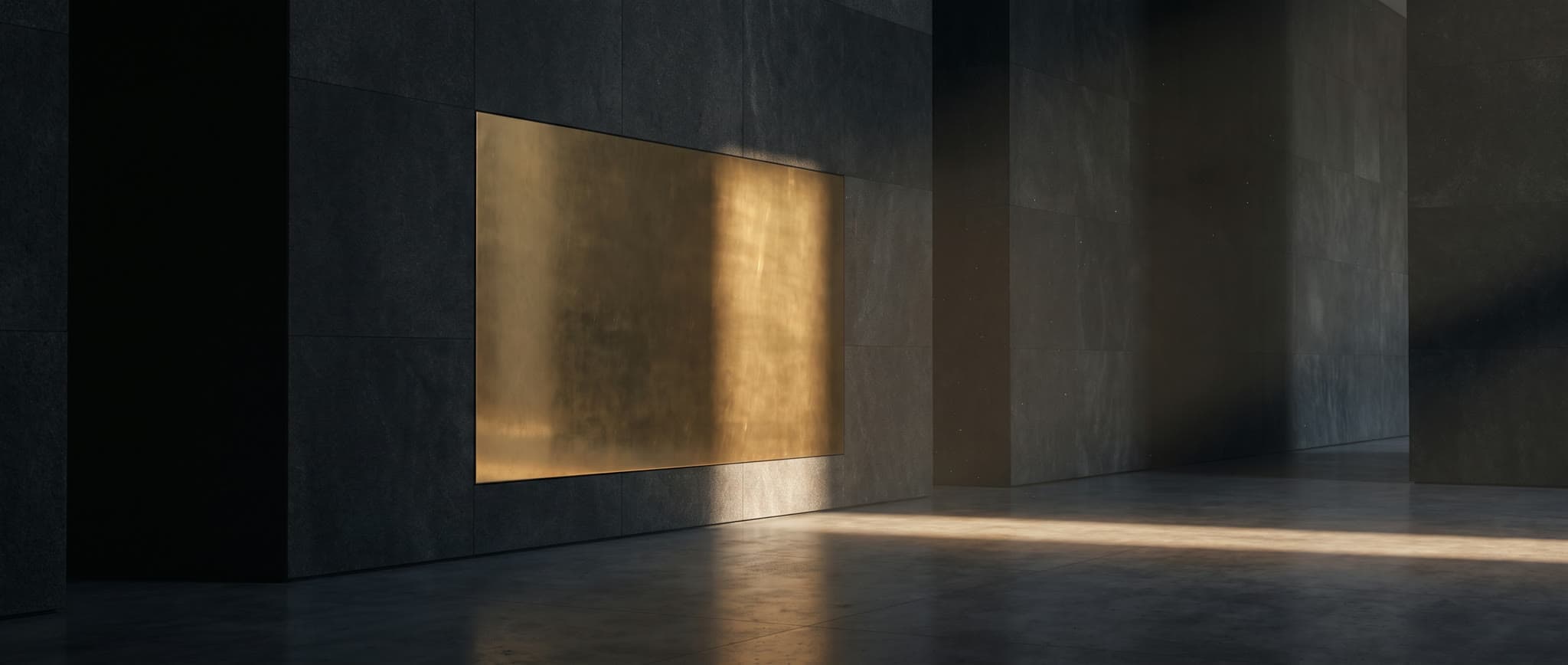 A massive unmarked brass plate set flush into a dark graphite stone wall.